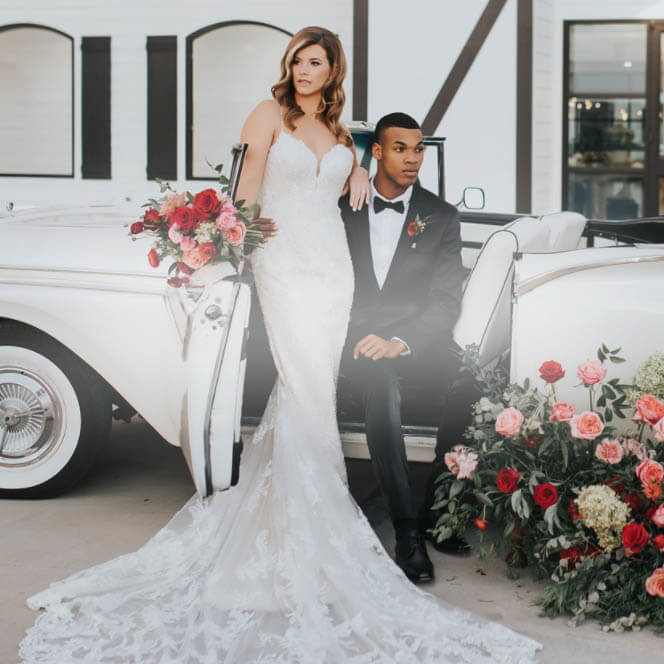 Couple wearing a white gown and black suit